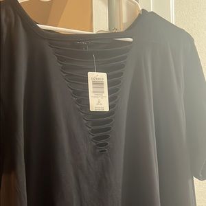 Torrid size 3. New with tags. It’s longer, goes to the hips. Super cute.